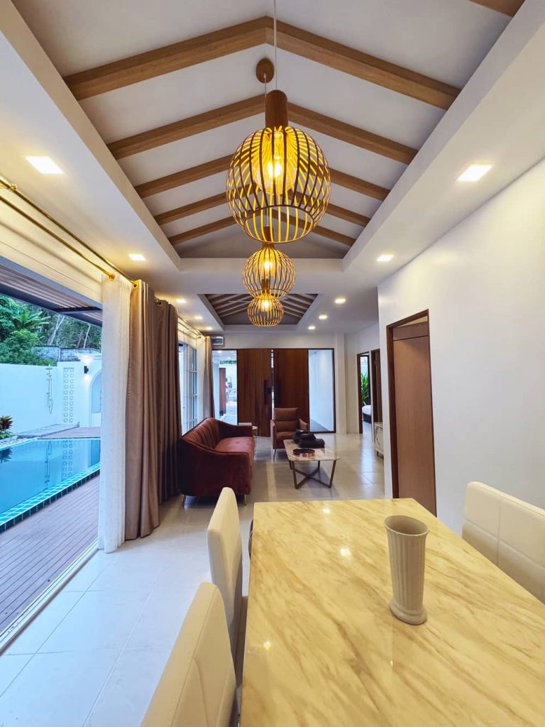 Cozy Living Room with View to Private Pool at Sarayah Phuket Villa